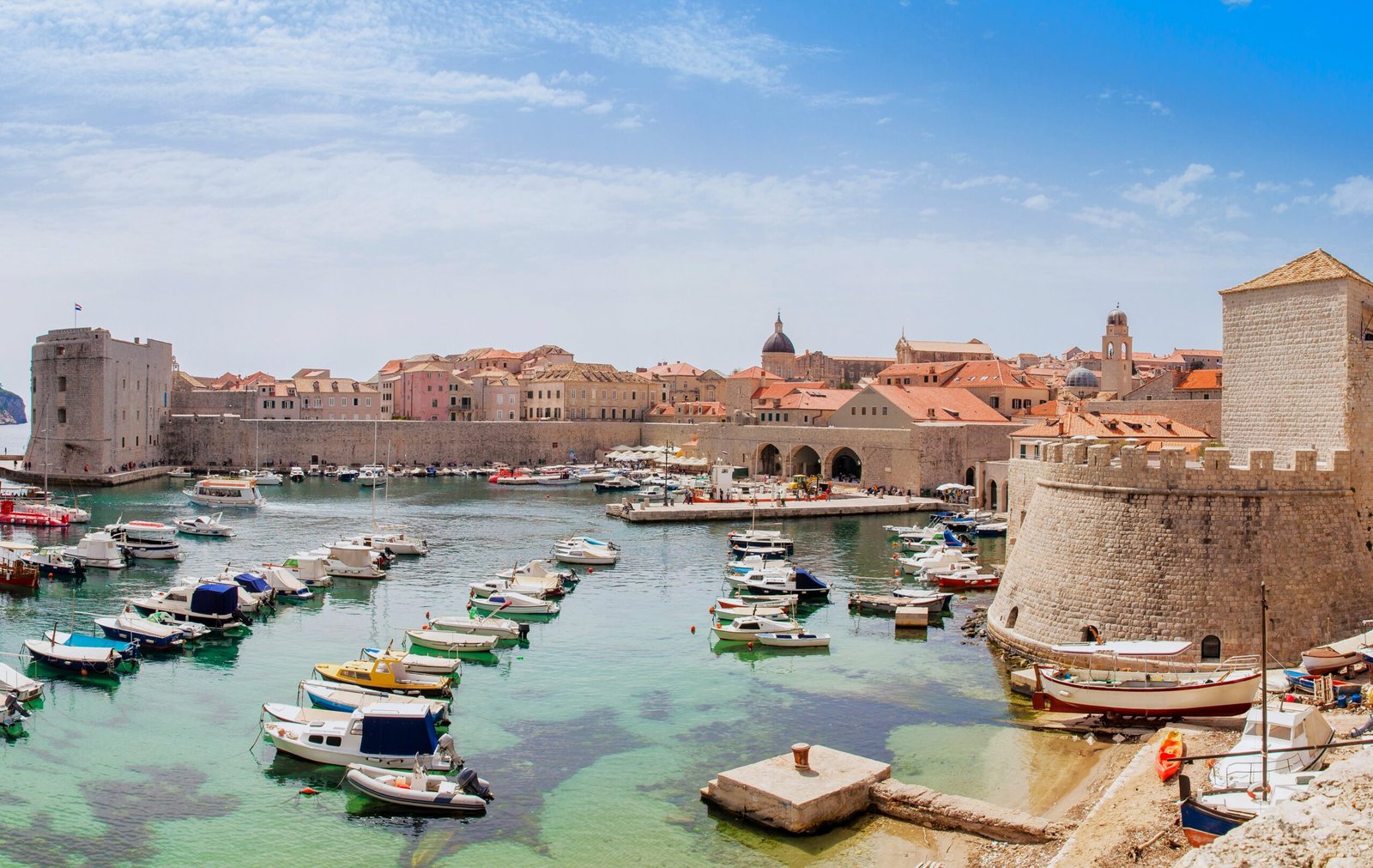 Mediterranean panorama of the beautiful Dubrovnik old city including the old port, city walls and fortifications.